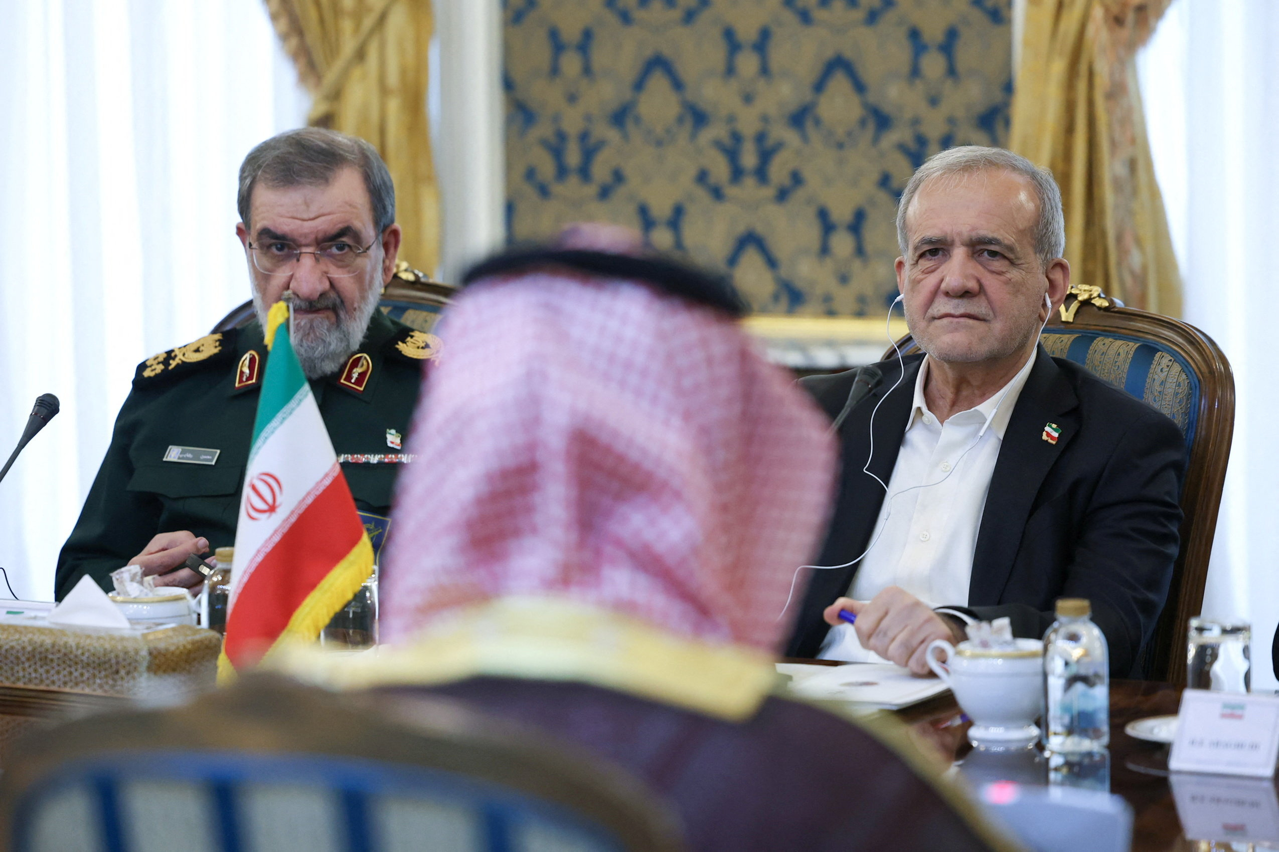 Iranian President Massoud Pazhakian and Secretary of Iran's National Security Council Mohsen Rezaei during the meeting.